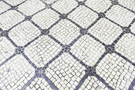 Typical stone floor Lisbon, detail of a typical floor with shapes and drawings, art Portugal, tourismの写真素材