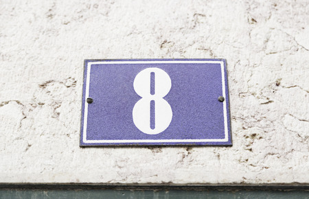 Number eight on a wallの写真素材