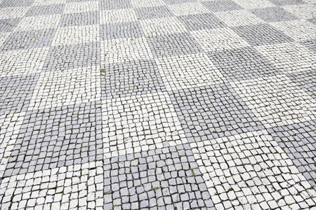 Typical stone floor Lisbon, detail of a typical floor with shapes and drawings, art Portugal,...