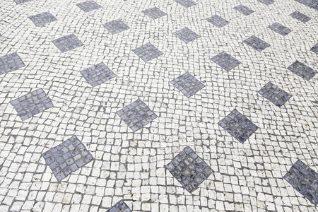 Typical stone floor Lisbon, detail of a typical floor with shapes and drawings, art Portugal, tourismの写真素材