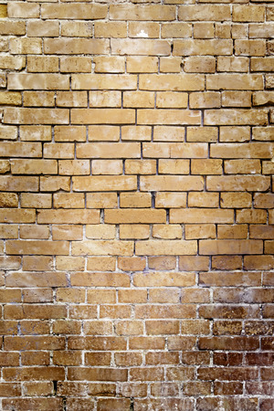 Brick wall background, detail of a building facade, textured backgroundの写真素材