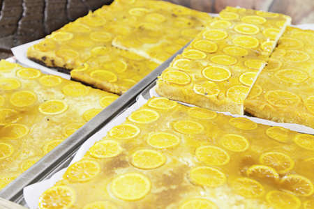 Lemon Tart craft, detail of homemade cake in a traditional market, fresh food, dessert