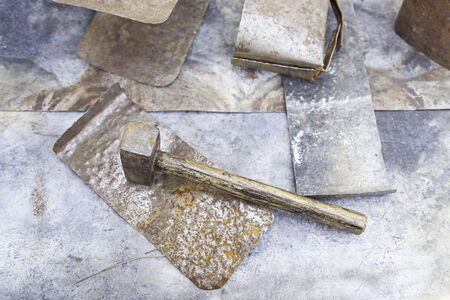 Hammer hitting metal, detail of a tool for blacksmithsの写真素材