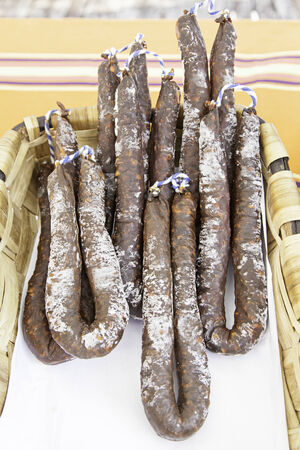 Dry Sausage in a market, detail of a typical Spanish sausageの写真素材