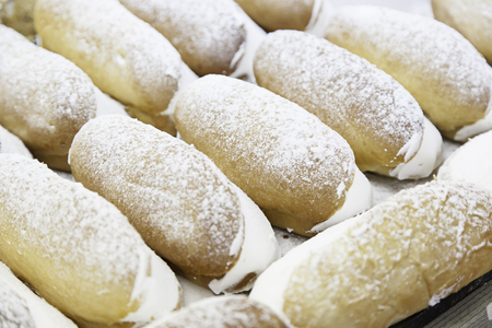 Bun stuffed with cream detail a handmade cake in a bakeryの写真素材