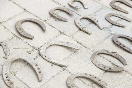 Old metal horseshoes for horses object detailの写真素材