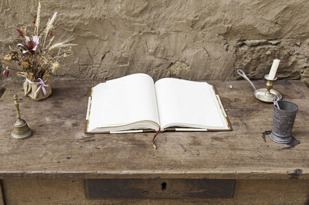 Empty book on a wooden table, detail of a blank bookの写真素材