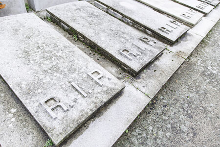 Empty graves in a cemetery, detail of a new graves, death and religionの写真素材
