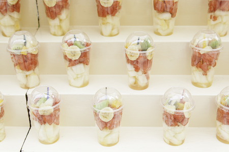 Glasses with fruit pieces, detail a few glasses of healthy foodの写真素材