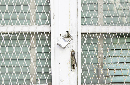 Old metal railing detail of a grid safety, securityの写真素材