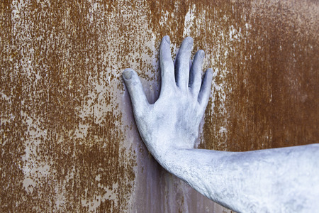 Rusty metal hand detail of a steel arm, texture and rustの写真素材