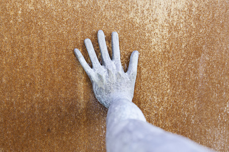 Rusty metal hand detail of a steel arm, texture and rustの写真素材