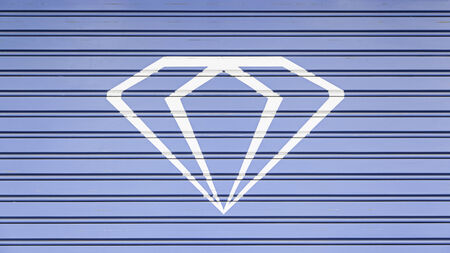 Diamond painted on a wall, detail of a decorated wallの写真素材