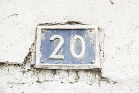 Number twenty on the wall of a house, number of information, even numberの写真素材
