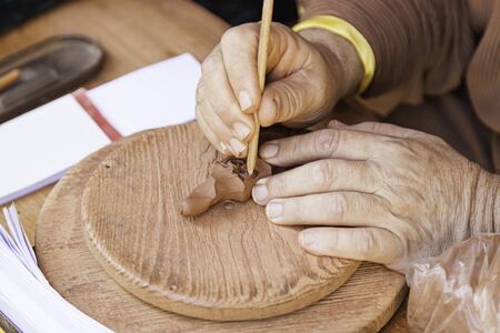 Potter working clay, detail person working, manual laborの写真素材