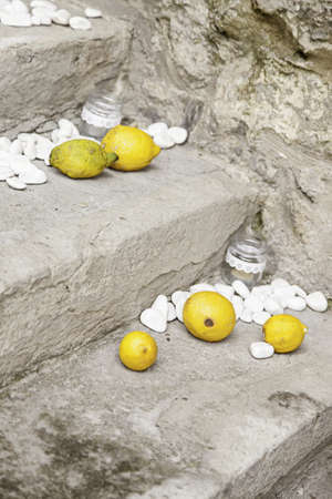 Lemons with stones in a spa, detail of a decoration with fruitの写真素材