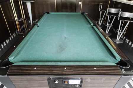 Pool table in a bar, detail of a board game, competition