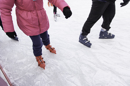 People ice skating, winter sports detailsの写真素材
