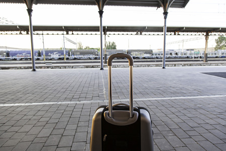 Suitcase in a train station, detail of a trip, vacationのeditorial素材