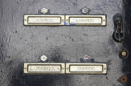 Mailboxes on a door, detail of a mailbox for correspondence, letters
