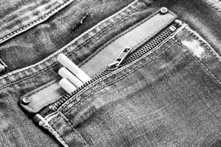 Snuff in jeans, pocket detail with snuff, cigars detail, texture textileの写真素材