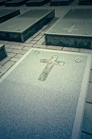 Marble tombstones with cross, gravesの写真素材