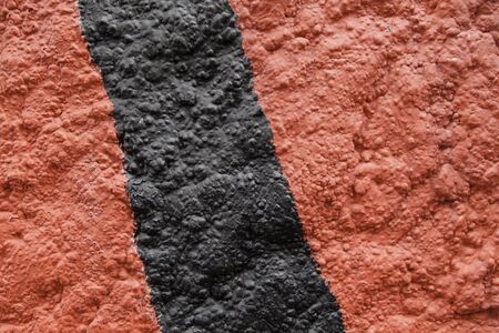 Red and black background, detail of a background with rough textureの写真素材