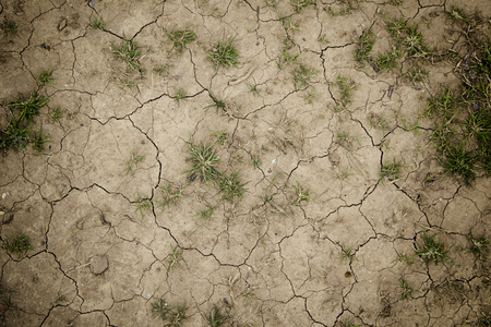 Dry soil by a drought, detail of climate change, ecological disasterの写真素材