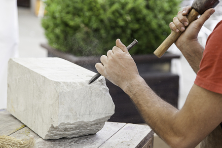 Carving stone, craftsman shaping stone, art and craftsの写真素材