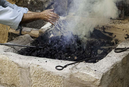 Extinguishing flames with water in the carbon, safety detail