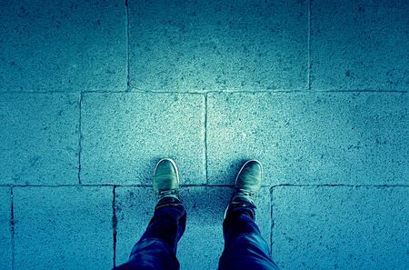 Feet floor, detail of walking boots