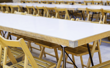 Big table with chairs for a celebration, detail of place for outdoor eating