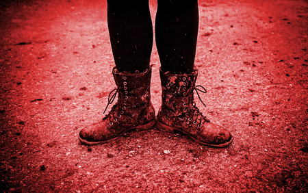 Women boots in the mud, detail of dirty boots and muddy, walkの写真素材