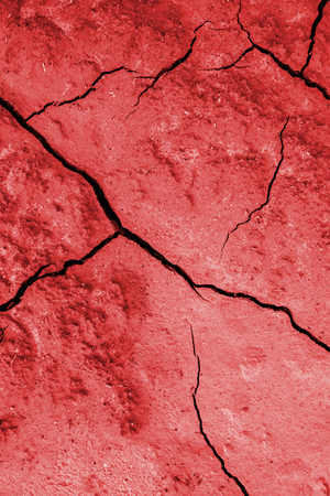 Soil cracked by climatic disaster, detail of drought and deathの写真素材