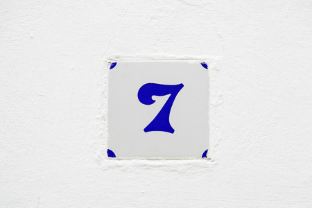 Number seven information on a wall, odd number detail, addressの写真素材