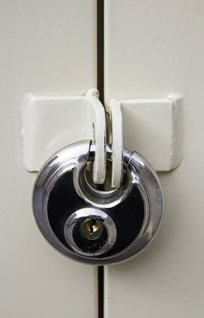 Silver padlock for protection and security, detail of anti-theft systemの写真素材