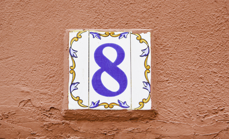 Number eight of information in a wall, detail of even number, addressの写真素材