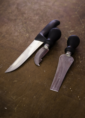 Knives for cutting cheese, detail of tools for cheese