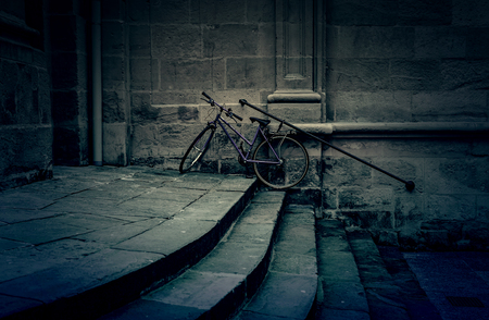 Bicycle parked on stairs, detail of a healthy transport and ecologicalの写真素材