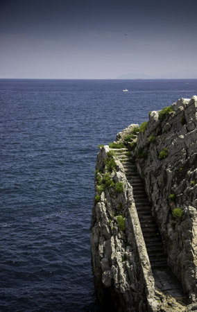 Stone stairs in the sea, detail of old water access