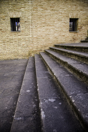 Staircase with window detail of old stone stairs, textured background, ancient architectureの写真素材