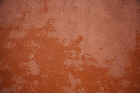 Red wall with texture, wall detail painted on the outsideの写真素材