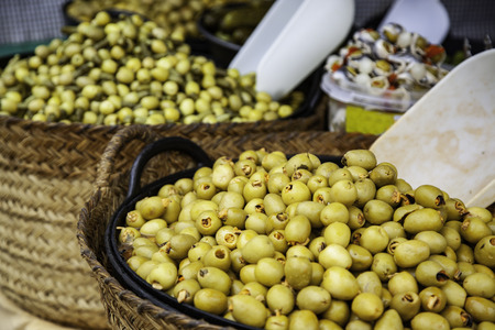 Olives in a market, detail of prepared food, appetizerの写真素材