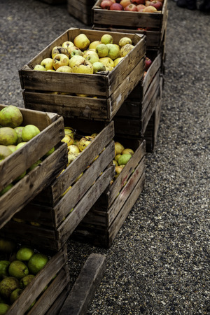 Apples in wooden boxes, detail of fresh fruit, diet and healthの写真素材