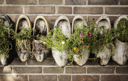 Dutch clogs craftsmen, manufacture of traditional footwear for the field