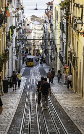 LISBON, PORTUGAL - September 08, 2016: Street view with famous old tourist tram full of people during the sunny day in Lisbon city, Portugalのeditorial素材
