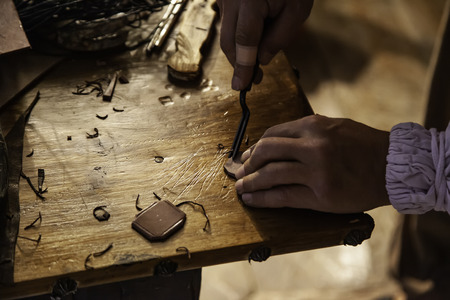 Person working with leather in traditional way, artisan work detailの写真素材