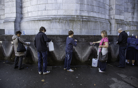 LOURDES, FRANCE - July 12, 2017: The Sanctuary of Our Lady of Lourdes, the destination for pilgrimage in France famous for the reputed healing power of its water on July 12, 2017 in Lourdes.のeditorial素材