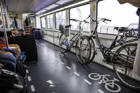 AMSTERDAM, THE NETHERLANDS - September 05, 2019: Passengers waiting for subway at central station of the new metro route 52 (NorthSouth Line) Public transportation system in Amsterdam, Holland.のeditorial素材