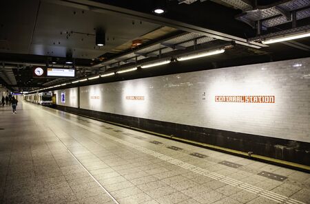 AMSTERDAM, THE NETHERLANDS - September 05, 2019: Passengers waiting for subway at central station of the new metro route 52 (NorthSouth Line) Public transportation system in Amsterdam, Holland.のeditorial素材